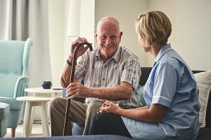 Patient sitting with health-care worker